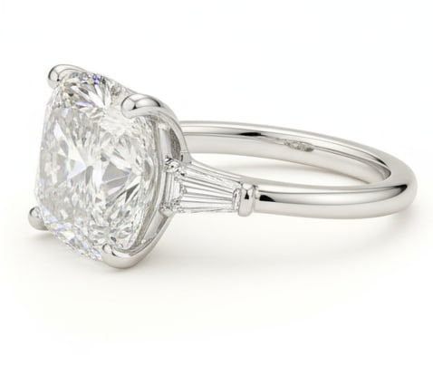 4.00 CT Cushion lab-grown diamond Diamond Three-Stone Engagement Ring in 14K White Gold: This sophisticated three-stone engagement ring features a 4.00 carat cushion-cut lab-grown diamond diamond accented by tapered lab-grown diamond baguette side stones, all set in a sleek 14K white gold