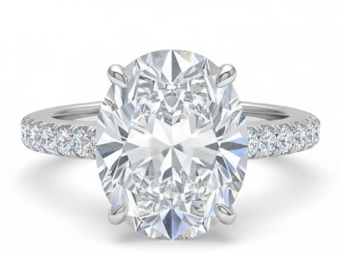6.00 CT Oval lab-grown diamond Diamond Pav? Band Engagement Ring in 14K White Gold: This elegant engagement ring showcases a substantial 6.00 carat oval lab-grown diamond diamond set in a refined four-prong basket, paired with a slim pav? diamond band in solid 14K white gold. The lab