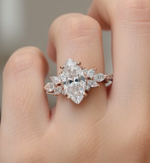 lab-grown diamond 7.00 CT Pear-Shaped Diamond Hidden-Halo Ring in 14K Rose Gold: This unique lab-grown diamond diamond ring showcases a 7.00 carat pear-shaped center stone in a hidden-halo design, expertly crafted in 14K Rose Gold. The smooth high-polish band is designed to sit co