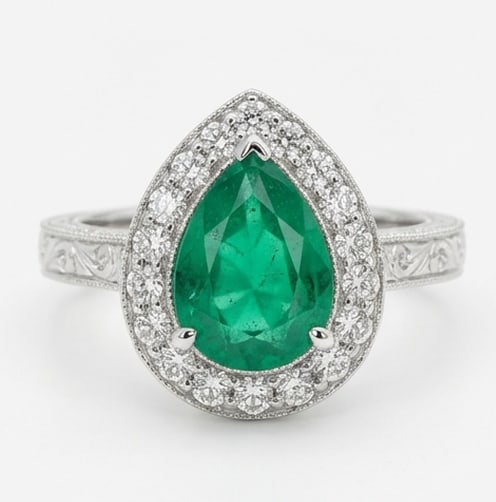 2.0 Ct Pear Natural Emerald 14K White Gold Vintage Halo with Engraving Ring - Certified: This certified fine jewelry piece features a 2.0 carat natural Emerald in a Pear cut, crafted in 14K White Gold. The Vintage Halo with Engraving design highlights the beauty of the natural center ston
