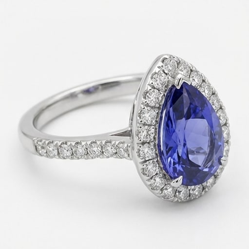 2.5 Ct Pear Natural Tanzanite 14K White Gold Halo Setting with Pave Shank Ring - Certified: This certified fine jewelry piece features a 2.5 carat natural Tanzanite in a Pear cut, crafted in 14K White Gold. The Halo Setting with Pave Shank design highlights the beauty of the natural center s