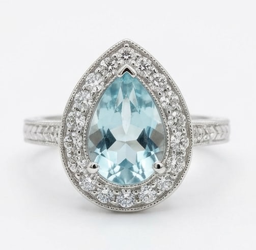 2.0 Ct Pear Natural Aquamarine 14K White Gold Vintage Halo with Engraved Shank Ring - Certified: This certified fine jewelry piece features a 2.0 carat natural Aquamarine in a Pear cut, crafted in 14K White Gold. The Vintage Halo with Engraved Shank design highlights the beauty of the natural cen