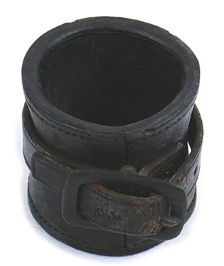 U.S. Civil War carbine boot: K-029 Round 2 1/2" thick black leather carbine boot. Strap and iron buckle. Marked "D.C.L.". II