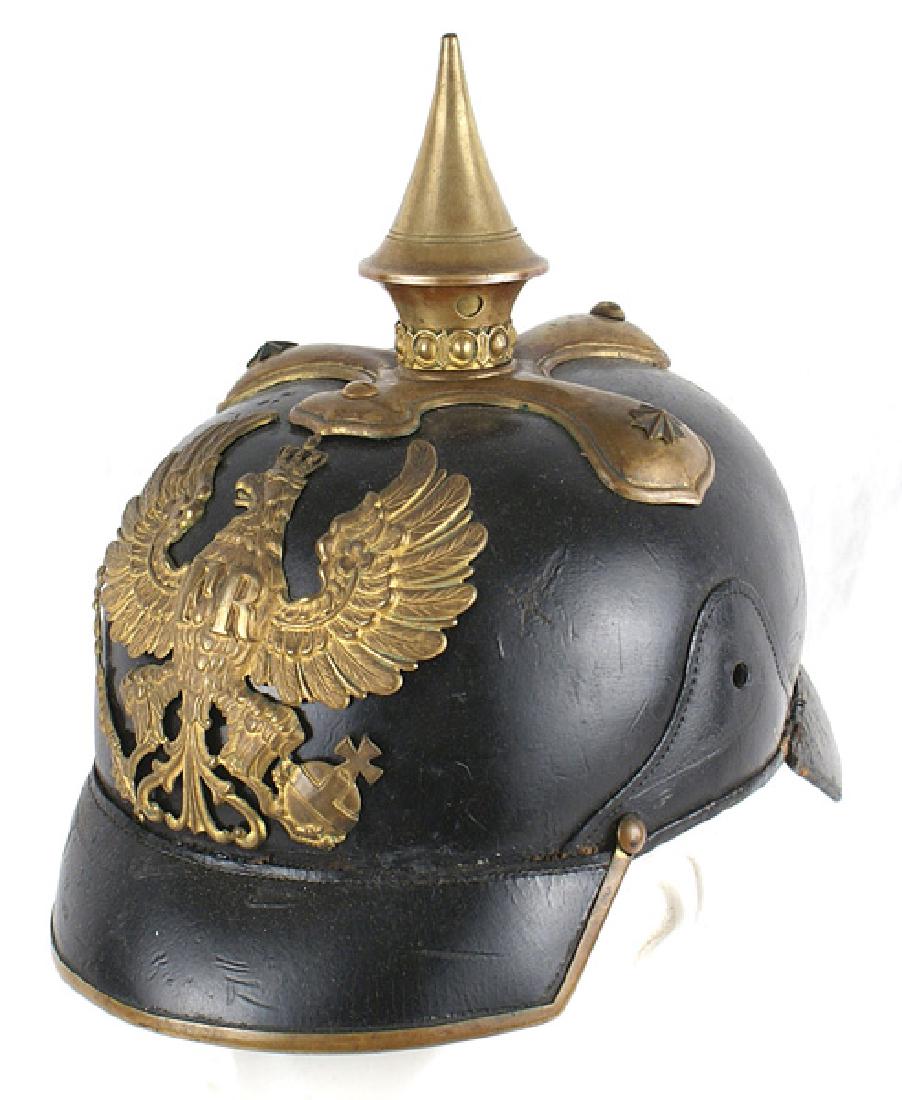 Imperial Prussian Dragoon officer helmet: E-002 Prussian Dragoon Officer's style helmet. Excellent solid condition body with a brass trimmed squared visor. Old style Prussian crowned eagle front plate bearing a relief "FR" only. This type pla