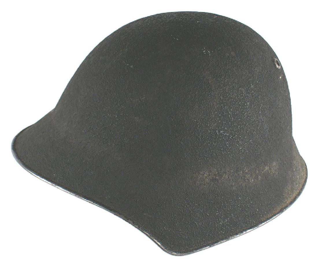 Swiss WWII Army helmet: E-070 Swiss Army helmet. O.D. "sand" finish. Three-pad liner. Leather chinstrap with a snap book. ID tag has owner's name. II