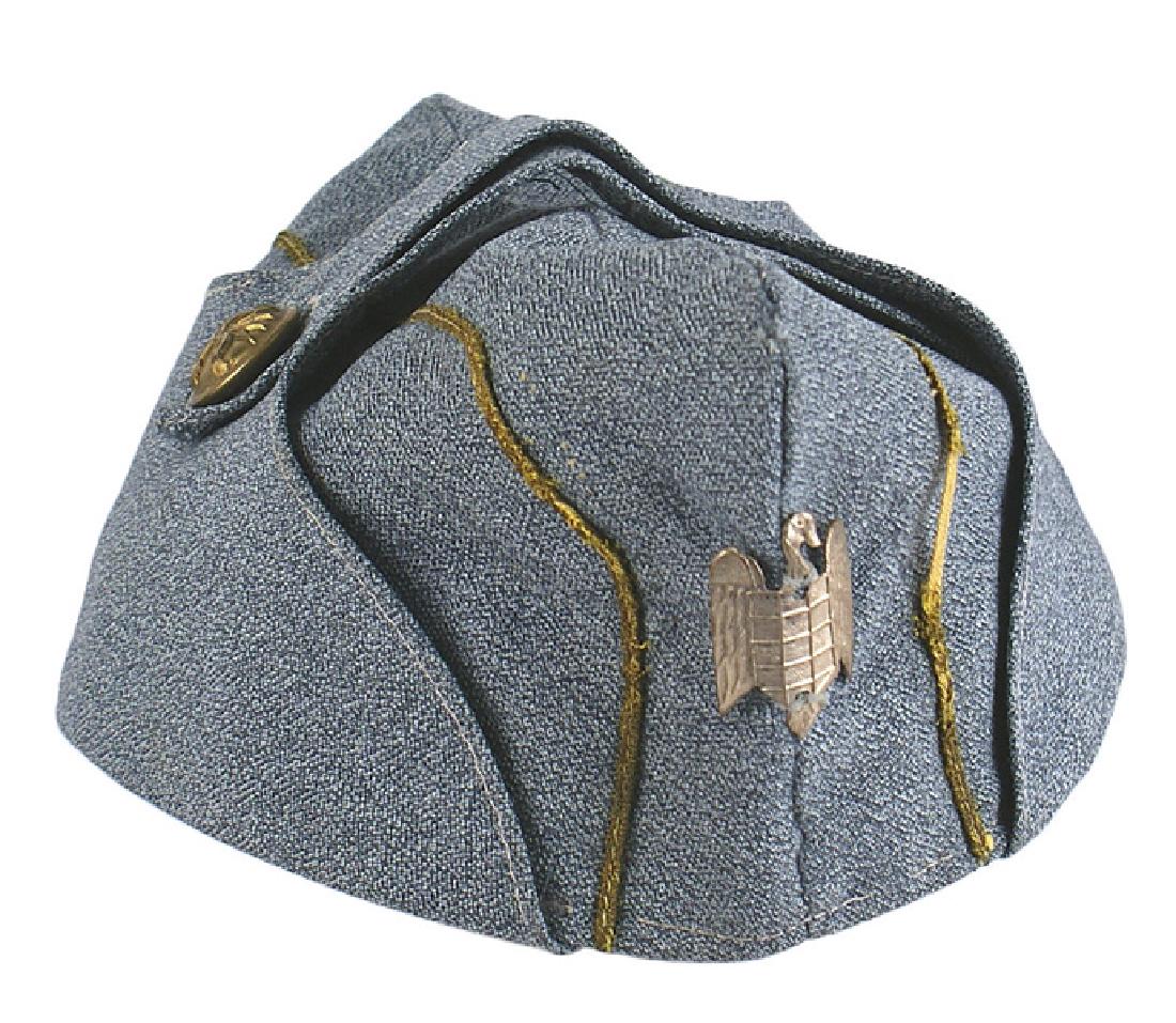 SEU Spanish Blue Division overseas cap: E-120 SEU (university student) members of the Spanish Blue Division officer's o'seas cap. Blue-gray material with a gold bullion cord piping (1" section is worn) on each side. Metal silver duck holdin