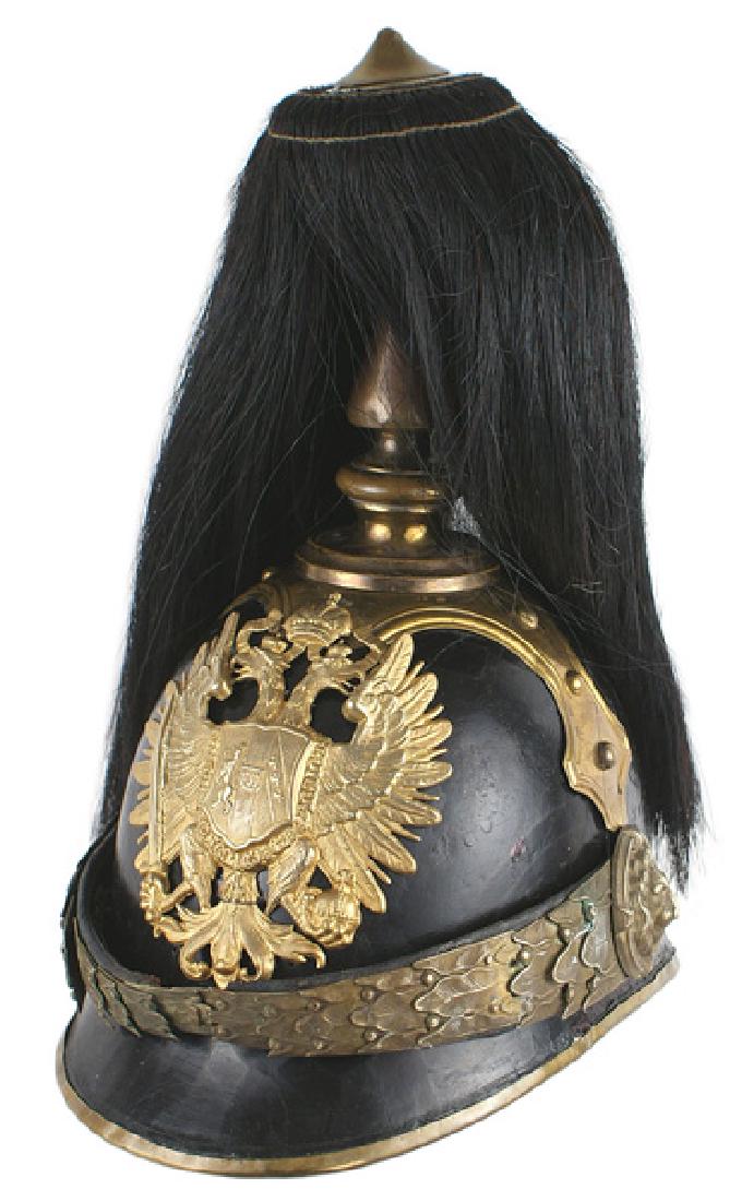 Imperial Austrian Lifeguard Cavalry helmet: E-165 Officer's dress helmet of the Imperial Austrian K.u.K. Liebgarde - Reitereskadron (Lifeguard Cavalry Squadron) of 1906. Black lacquered body and visor. Brass trimmed lower border of the helmet. 