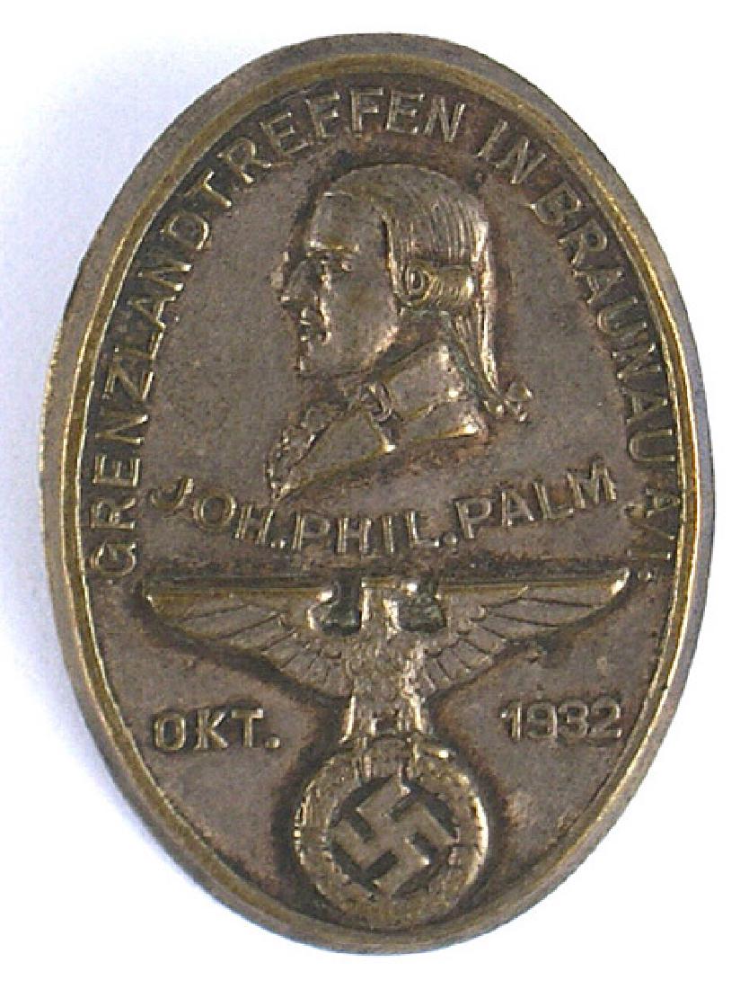 German WWII tinnie Braunau Austria: B-058 Early Nazi "tinnie" commemorating the October 1932 cross-border march to Braunau (Hitler's birthplace) in Austria. Relief eagle/swastika and profile of Johan Palm. Reverse is maker marked. Scarc