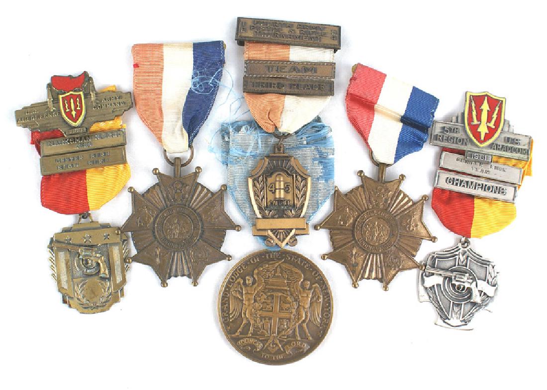 Lot of 6 U.S. medals Masonic service Marksman: B-194 Lot of 6 U.S. medals: (1) 1891 Grand Masonic Lodge of New York 50 year "DEVOTION" award. Named and serial numbered. (2) Two Utica, New York WWII service medals. (3) Three different Army Marksman