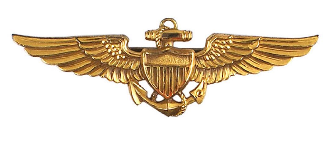 U.S. Navy WWII gilt Pilot Wings: B-203 U.S. Navy WWII gilt Pilot's Wings. Fouled anchor/shield in center. Pin-back. Reverse marked "1/20 10K CF - BALFOUR". II+