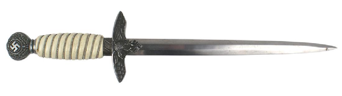 German WWII Luftwaffe dagger 2nd Model: D-024 German WWII Luftwaffe Officer 2nd Model dagger. Age darkened oak leaf/swastika decorated pommel and flying eagle/swastika crossguard. Silver wire wrapped white grip. 10 1/4" unmarked clean blade