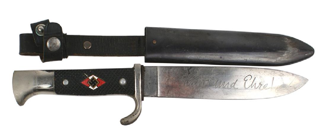 German WWII Hitler Youth dagger: D-034 German WWII Hitler Youth dagger. Some age wear to the nickeled pommel and turned-up crossguard. Red/white enameled diamond with a swastika, sent into the black checkered plastic grip. 5 1/2" bla