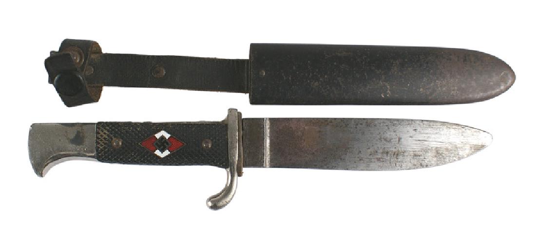 German WWII Hitler Youth dagger: D-036 German WWII Hitler Youth dagger. Nickeled pommel (worn spot from the retaining strap) and turned-up crossguard. Checkered plastic grips with an enameled HJ diamond 5 3/8" gray, with dark spots, 
