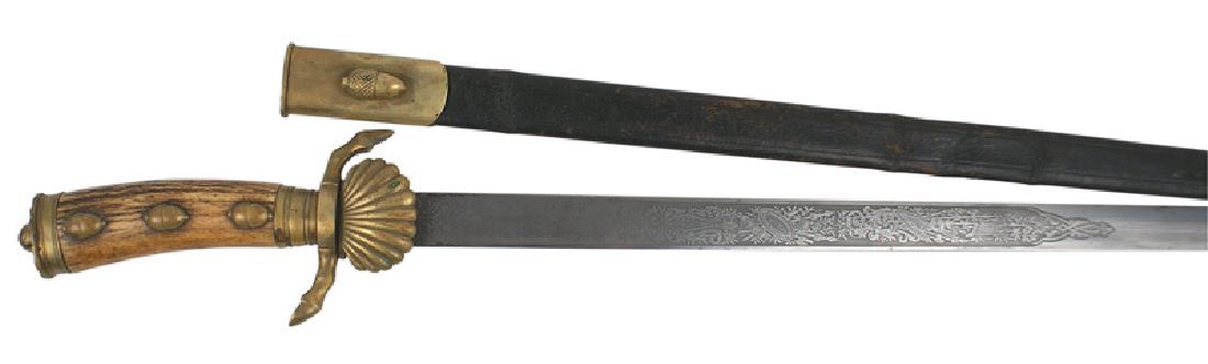 German Hirschfanger hunting dagger: D-056 Imperial German Hirschfanger. Brass ball on the sun-rays flat pommel, brass acorns on the stag grip, deer hoofs crossguard and "clamshell" guard. 19 1/4" blade etched with military and floral mo