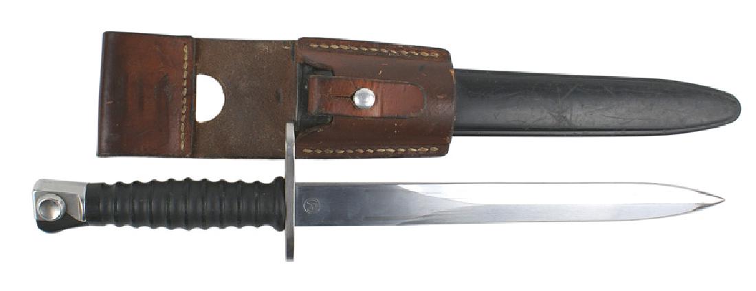Swiss SIG sturmgewehr Model 57 bayonet: D-099 Swiss SIG sturmgewehr Model 57 bayonet. Polished steel pommel on a ribbed black plastic grip. Crossguard is polished steel as well. Excellent 9 1/4" blade is marked "FW" and "W" over "297334". B