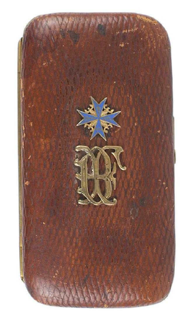 Pour le Merite Lt. Franz Buchner cigar case: A-004 Custom quality cigar case of Pour le Merite recipient Lt. Franz Buchner. Tooled quality brown leather with a profusely floral engraved gilt frame and sliding locking device. Cover has an affixed