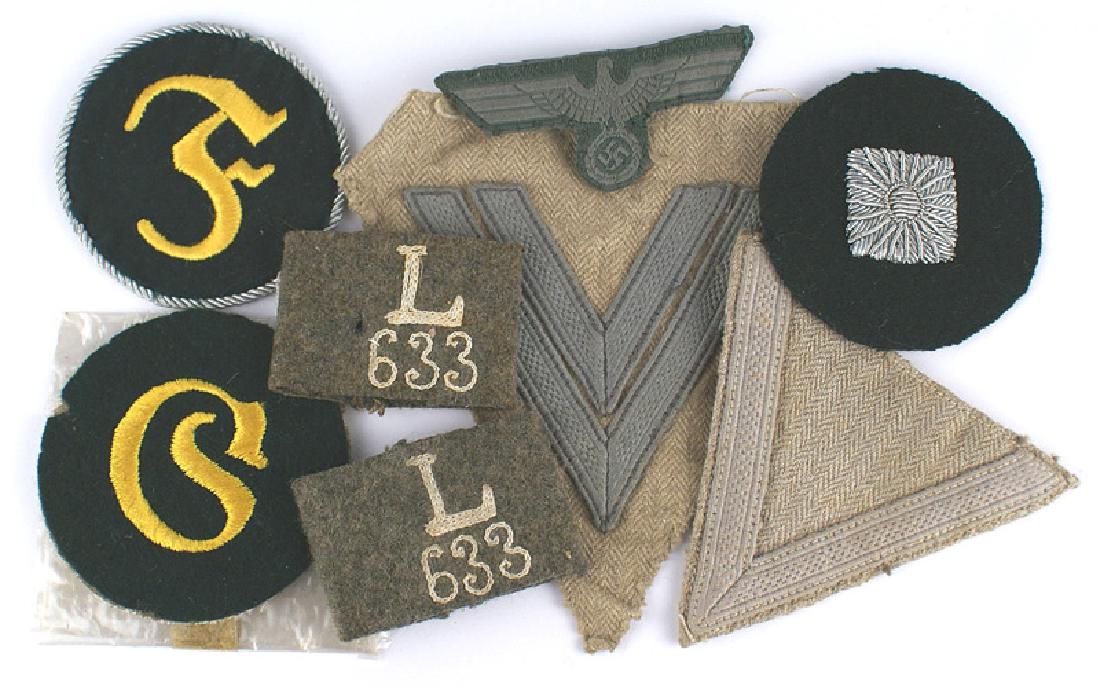 Lot of German WWII Army cloth insignia: H-044 Lot of German WWII Army cloth insignia: (1) Oberschutz silver bullion embroidered "pip". (2) Motor Transport NCO sleeve badge. (3) NCO Ordnance Technician sleeve badge. (4) EM o'seas cap eagle. 