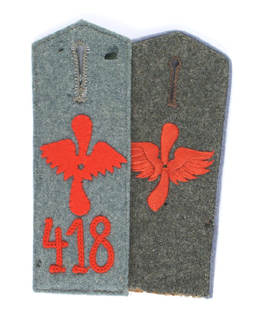 Prussian WWI Aviation boards: H-114 Lot of 2 single Prussian WWI Aviation shoulder boards: (1) Wider type feldgrau with a red embroidered feathered winged propeller and gray piping. (2) Gray pointed-type with a red felt winged pro