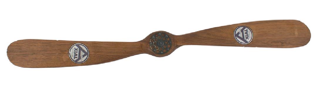 German WWI Period salesman sample propeller: H-123 German WWI Period salesman's sample propeller. 18 1/2" light wood with metal cowlings. Maker's paper decal "AXIAL - BERLIN" on each blade. Three minute "bites" on edge of blade, otherwise in exc