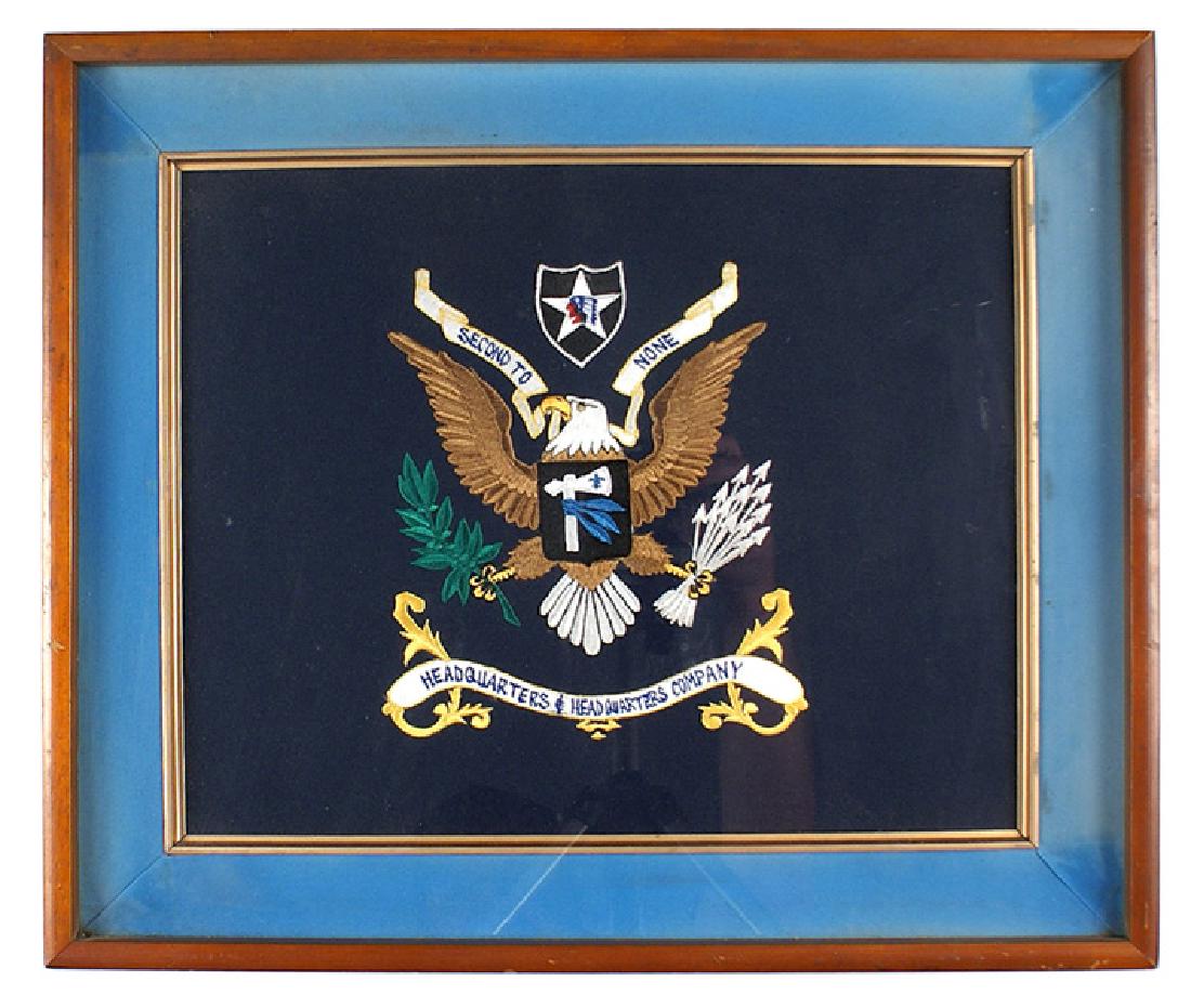 U.S. Army 2nd Division mini HQ flag: H-170 U.S. Army 2nd Division miniature HQ flag. Multi-colored high relief embroidered American eagle/2nd Division patch/HQ shield and legend. All on dark blue backing. Professionally matted and framed