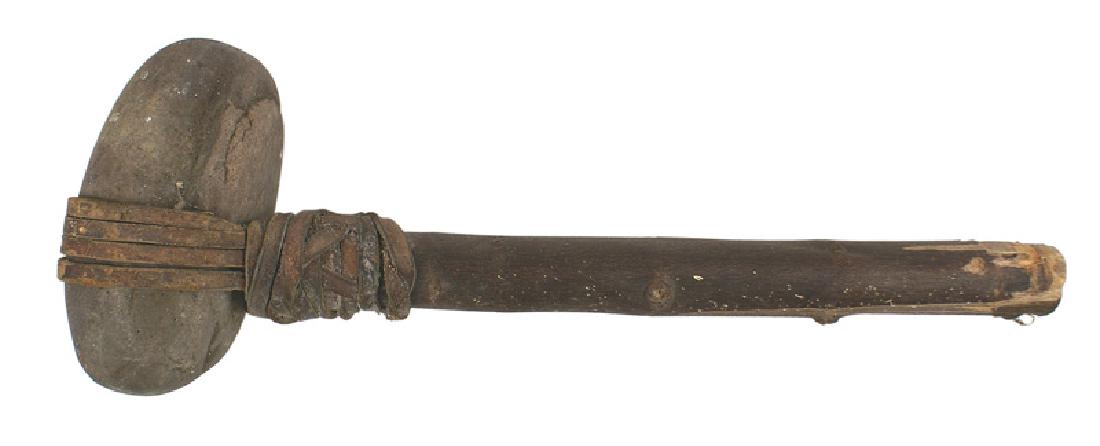 American Indian Iroquois War Club: R-041 American Indian Iroquois War Club. Archaic "polished" 5" x 2 1/4" x 2 1/2" stone head. Attached to a 11 3/4" "tag" wood shaft with strips of rawhide. Circa 1900. Head is loose. About II