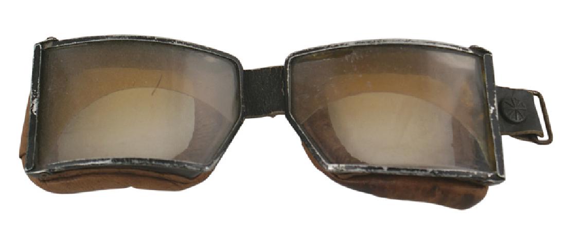 German WWII Luftwaffe goggles: N-017 German WWII Luftwaffe goggles. One-half of each lense is tinted. Heavy leather padding on the metal frames. Missing the strap. II