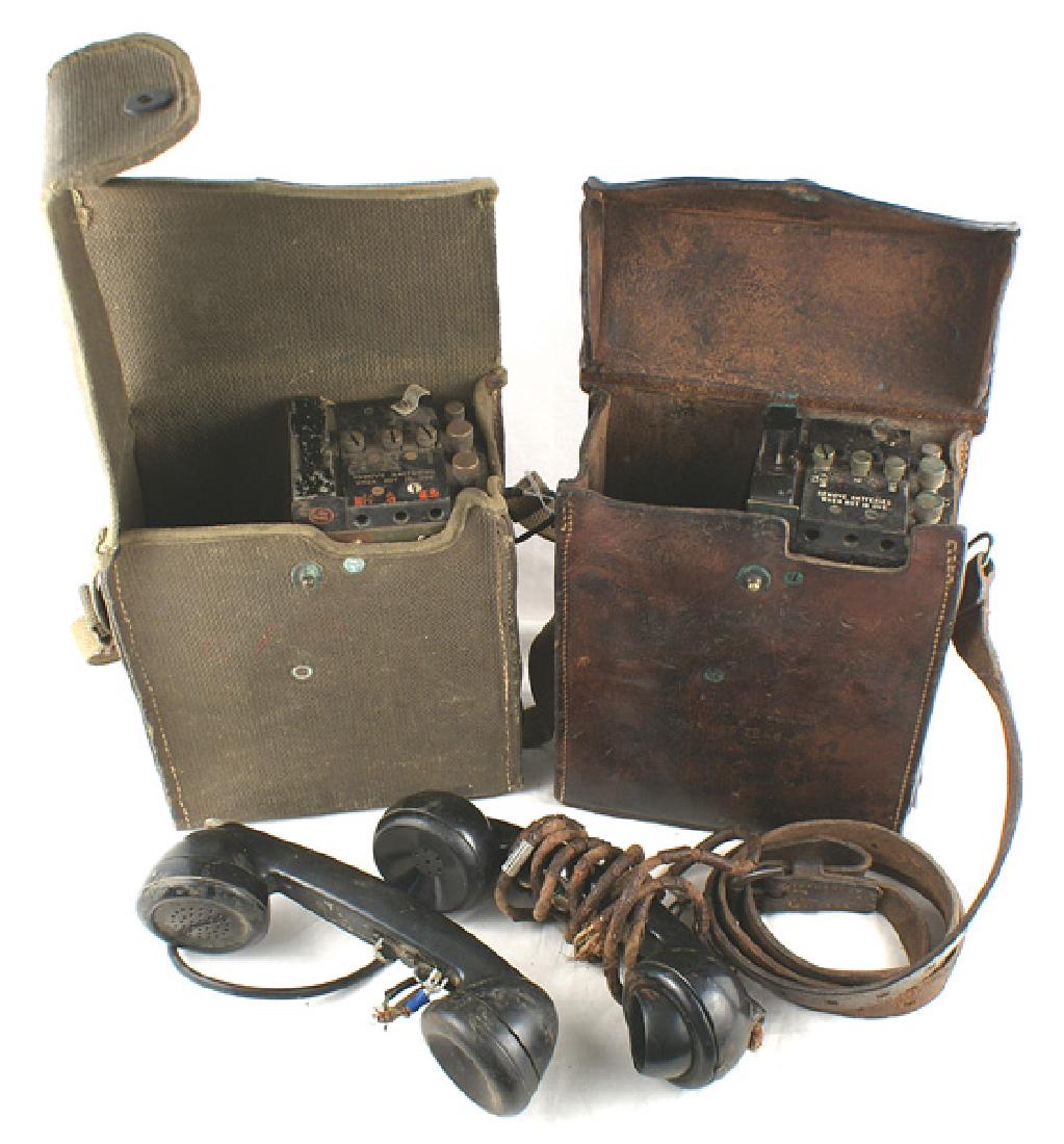 Lot 2 U.S. Army WWII Model EE-8 telephones: N-076 Lot of 2 U.S. Army WWII Model EE-8 field telephones. Both are complete. One has the first type leather carrying case with shoulder strap (split), and the other has the second type with a waterpr