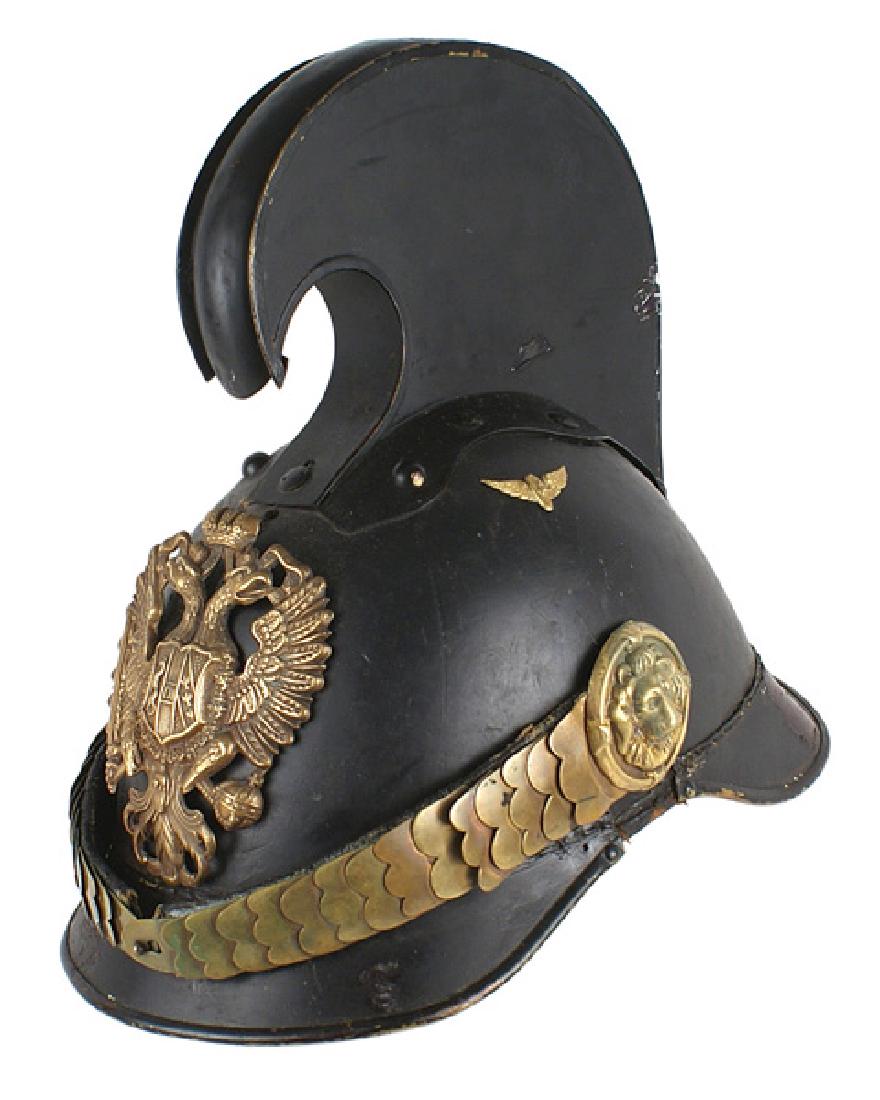 Imperial Austrian M1905 NCO Dragoon helmet: E-003 Imperial Austrian M1905 Non-commissioned officer's Dragoon/Cuinassier Model helmet. Black lacquered leather helmet with metal visors. Brass double-headed eagle frontplate and chinscales with rel