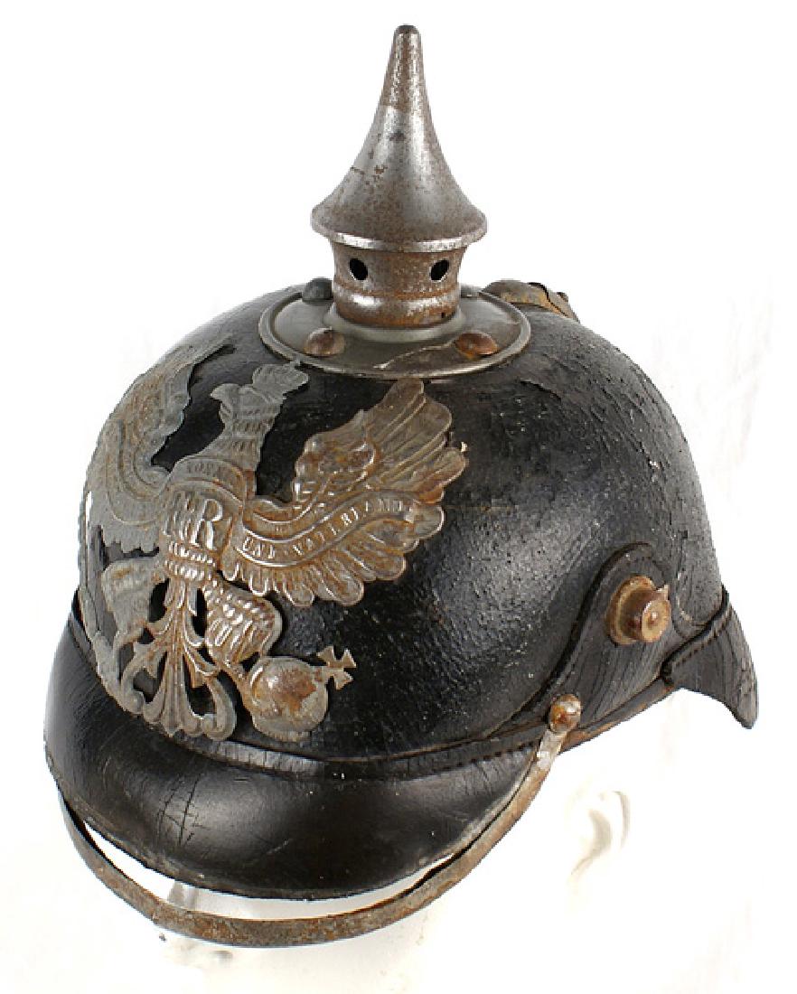Imperial German Prussian EM pickelhaube: E-012 Imperial German Prussian EM "pickelhaube". Standard WWI type - black leather body shows some slight "bubbling" on the finish and a small frontal area is missing the veneer. Some of the gray fini