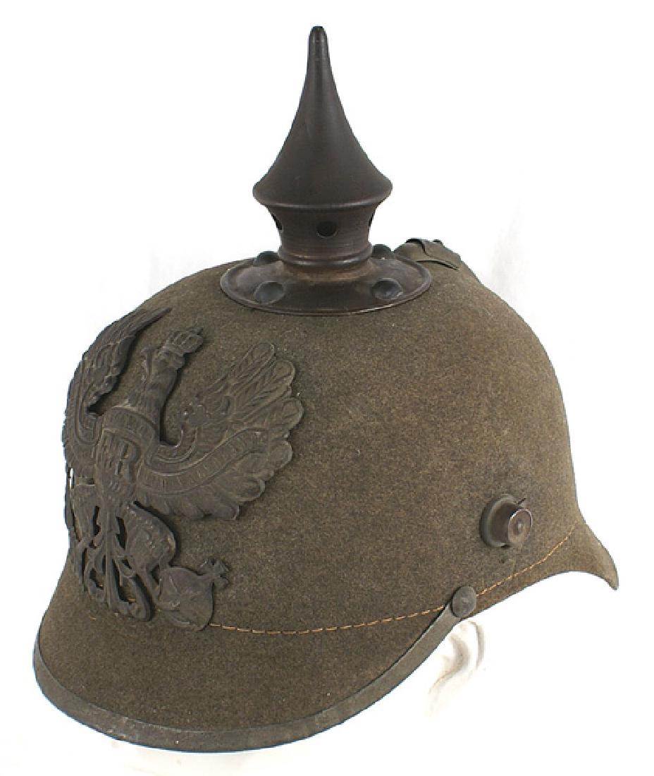 German WWI 171st Regiment ersatz pickelhaube: E-013 German WWI 171st Regiment "ersatz" pickelhaube. Felt body with a darkened gray Prussian eagle front plate, spike/base, visor trim, spine and chinstrap lugs. Good solid shape. Underside of the ba
