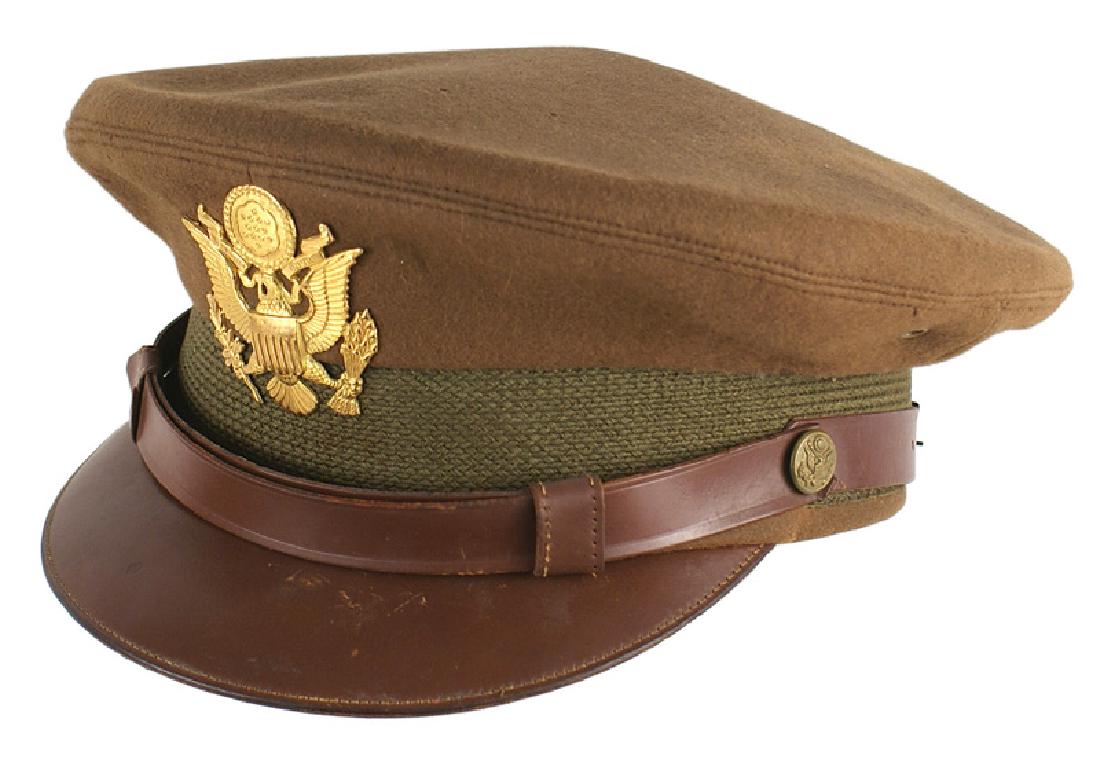 U.S. WWII Army officer peaked cap: E-101 U.S. WWII Army officer's peaked cap. OD wool body with a green band. Solid brown leather brim with both brown leather chinstraps. Large gold American eagle cap badge. Mothing under the back over