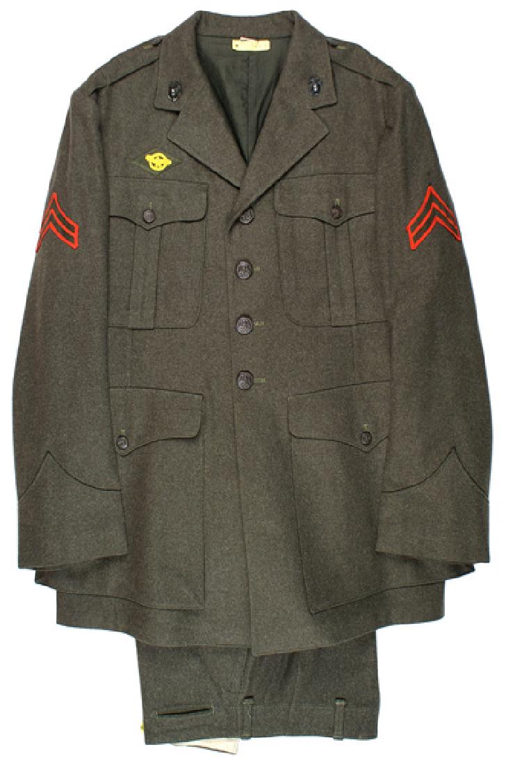 Lot 2 U.S. WWII Marine Corps uniforms: F-080 Lot of 2 U.S. WWII Marine Corps green wool uniforms: (1) Four-pocket tunic with a cloth waist belt. Sleeve lining is stamped with maker, contract number and is dated "DEC. 1, 1943". Size approxi