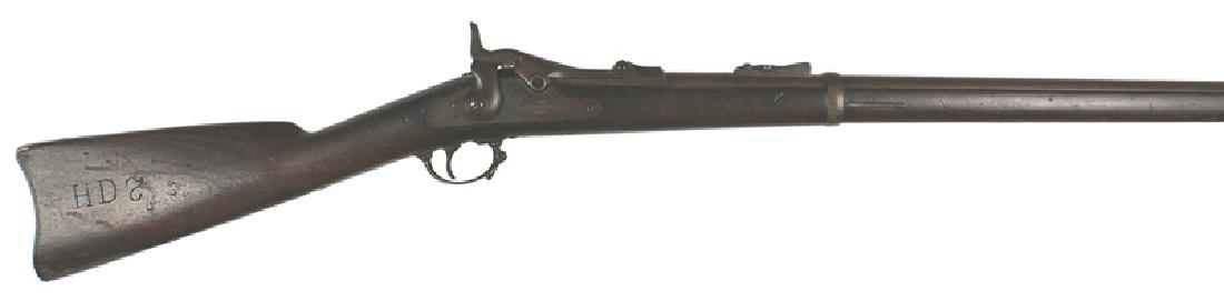 U.S. M1873 Springfield trap door rifle: M-030 U.S. M1873 Springfield "trapdoor" rifle. 32 1/2" barrel with a mounted long range sight. Full stock with two barrel bands and sling swivels. With original cleaning rod. Breech block is marked "M