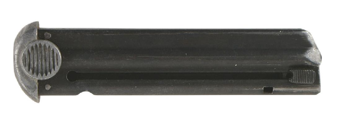 Japanese WWII Nambu pistol magazine: M-085 Japanese WWII Type 14 Nambu pistol magazine. Blued and numbered "838". Aluminum base/knobs. II