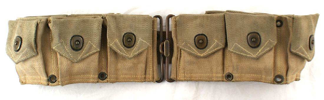 U.S. M1910 dismounted cartridge belt: M-102 U.S. M1910 dismounted, 10 dot snap pocket cartridge belt. Tan with light green flaps. Name stenciled on inner belt "S.R. DOUGLAS". Used is both World Wars. II