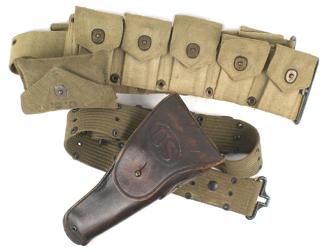 Lot of 2 U.S. WWII belts Pistol Marines: M-106 Lot of 2 U.S. WWII web belts: (1) Pistol belt - dated "1944". With a brown leather Colt 45 cal. pistol holster. Marked "SEARS". (2) Marine Corps web cartridge belt. Ten snap flap pockets. Marked