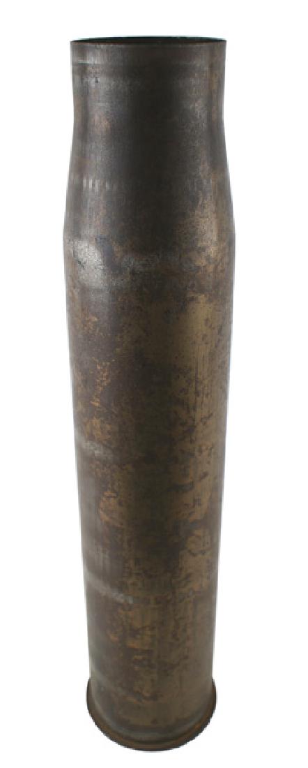 German WWII 75 cm artillery casing: M-132 German iron 75 cm artillery casing. Stamped with a Waffen mark, "52", "6339 St", "75cm KWK 40" and dated "44". 19 1/2" tall. Weight 5.5 pounds. II-