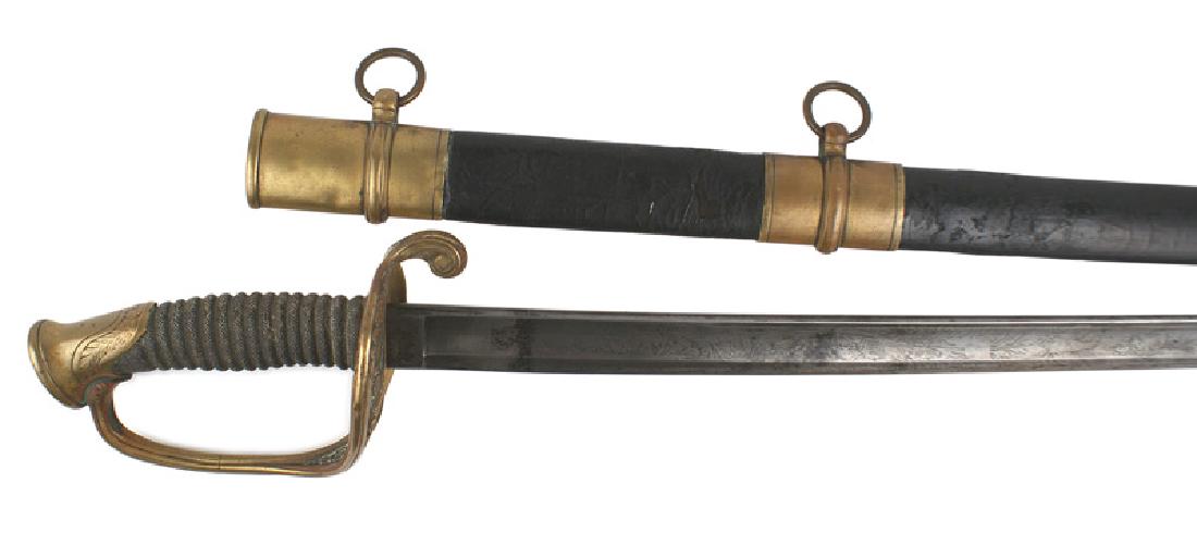 U.S. Staff M1850 officer sword: K-017 U.S. Staff M1850 Officer's sword. Floral decorated brass pommel, reverse "D" knuckle bow and pierced floral work guard. Wire missing from the sharkskin wrapped grip. 30 1/4" blade is etched with