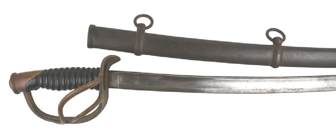 U.S. M1860 Light Cavalry sword: K-020 U.S. M1860 Light Cavalry saber. Leather wrapped grip. Age darkened brass pommel cap and three - branch guard. Tip of crossguard is bent downward. 34 3/4" curved blade has grayed with fingerprint
