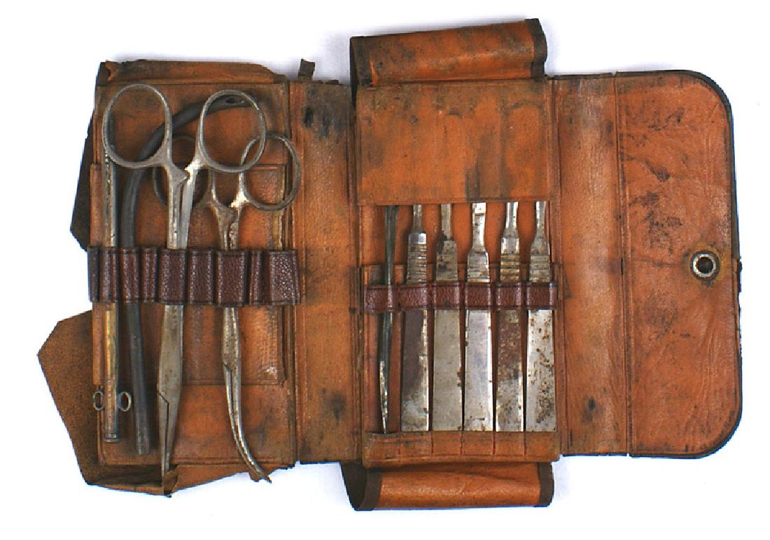 Antique U.S. pocket surgeon kit Circa 1890: K-058 Antique U.S. pocket surgeon's kit. Quality leather fold-out case holding 10 medical tools. Shows age and wear. One implement is marked "SETZ". Circa 1890. II-