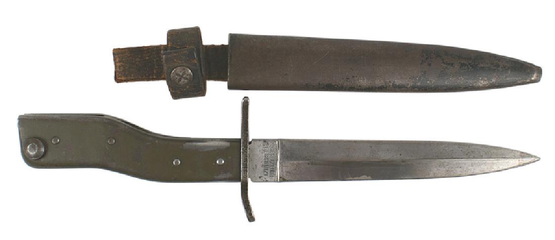 German WWI trench knife bayonet crank hilt: D-038 German WWI trench knife/bayonet. Flat green finish "crank" hilt. Flat crossguard. 6" double edged blade. Maker marked "DEMAG - DUISBURG". Also marked "GESETZLICH GESCHUTZT". Overall, has some or