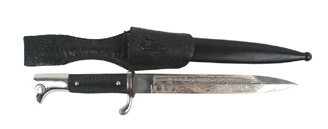 Engraved German WWII K-98 dress bayonet: D-049 Engraved parade dress K-98 bayonet. Clean nickled "bird head" pommel and short crossguard. Checkered black bakelite grip. 8 3/4" blade etched with "In Commeration of My Military Service Time", o