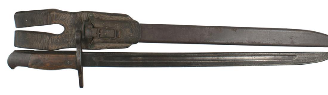 Japanese Arisaka M1897 bayonet: D-060 Japanese Arisaka M1897 bayonet. Age darkened steel pommel and muzzle ring/straight crossguard (no curved quillon). 15 5/8" sharpened blade which shows patches of the original darkened finish. Da