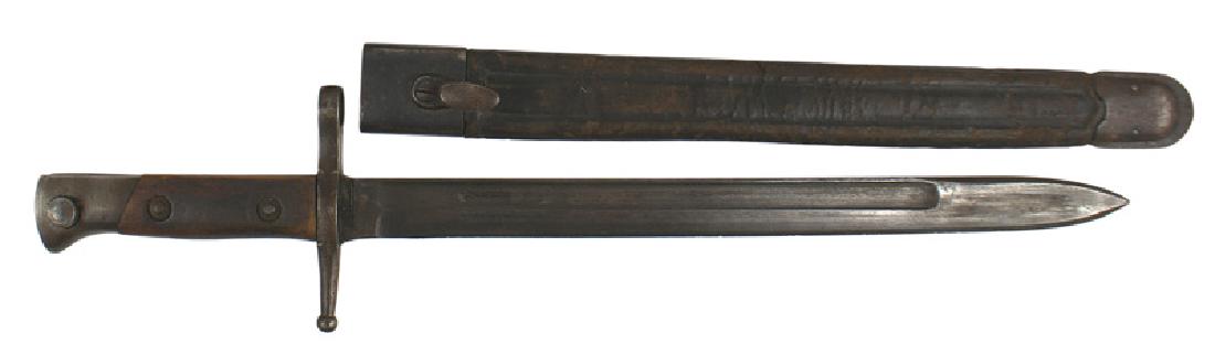Italian M1891 bayonet: D-081 Italian M1891 bayonet. Steel pommel and muzzle ring/straight crossguard. Wood grips. 11 3/4" blade marked "TERNI", retains 75% of the original darkened finish. Solid black leather scabbard shows