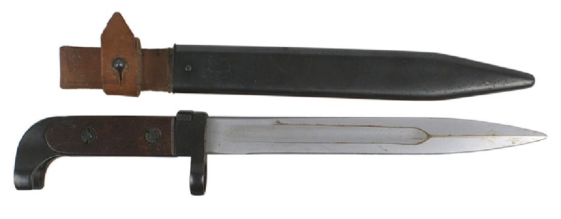 Soviet AK47 bayonet: D-085 Soviet AK47 bayonet. Blued steel curved open pommel and short crossguard ("1958") muzzle ring. Bakelite grips. Clean 8" single edged blade. Dark blued steel scabbard with an attached leather bel