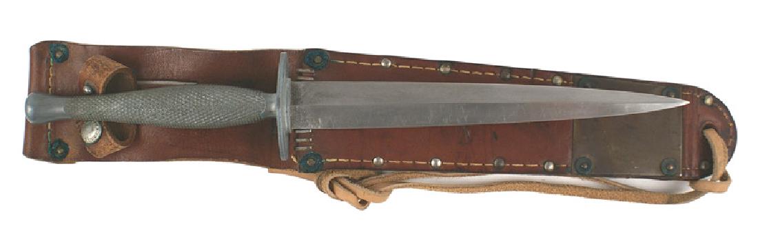 USMC WWII Stiletto commando knife Fairbairn: D-092 U.S.M.C. Stiletto. Copied from the famous British Fairbairn commando knife. One-piece tapered knurled gray metal handle with a rounded pommel. Oval shaped crossguard. 7 1/4" double edged, unmark