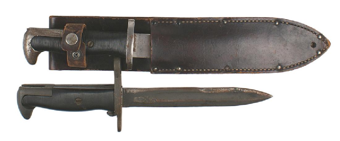 Lot 2 U.S. M1942 Garand bayonets combat knives: D-100 Lot of 2 U.S. M1942 Garand bayonets modified to combat knives: (1) Blade replaced with a 6 5/8" combat knife blade. Darkened and shows use. (2) Finish removed on fittings and blade cut down to 7