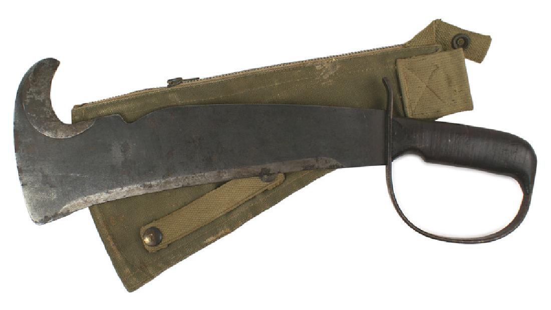 WOODMANS PAL U.S. fighting survival weapon knife: D-102 U.S. "WOODMAN'S PAL". Single blackened strap knuckle bow-marked "LC-14-B". Leather rings grip. 2 1/2" wide x 11 3/4" axe-type blade with a hooked end. Blade edge had been sharpened at one time b