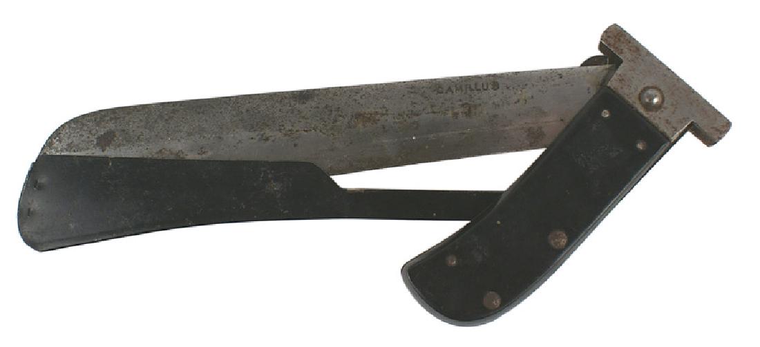 U.S. WWII folding machete survival knife: D-111 U.S. WWII folding machete survival knife. Black bakelite grip with a steel crossguard. 10" machete blade is maker marked "CAMILLUS". Upper part of blade has darkened and should be cleaned. Black