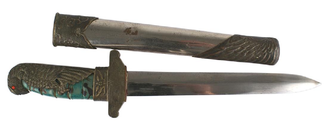 Chinese Nationalist WWII Air Force dagger: D-127 Chinese Nationalist WWII era Air Force dagger. Green with black markings, tortoise shell grip wrapped with a 3" detailed age darkened, hawk with red stone eyes - covering over half of the grip. 